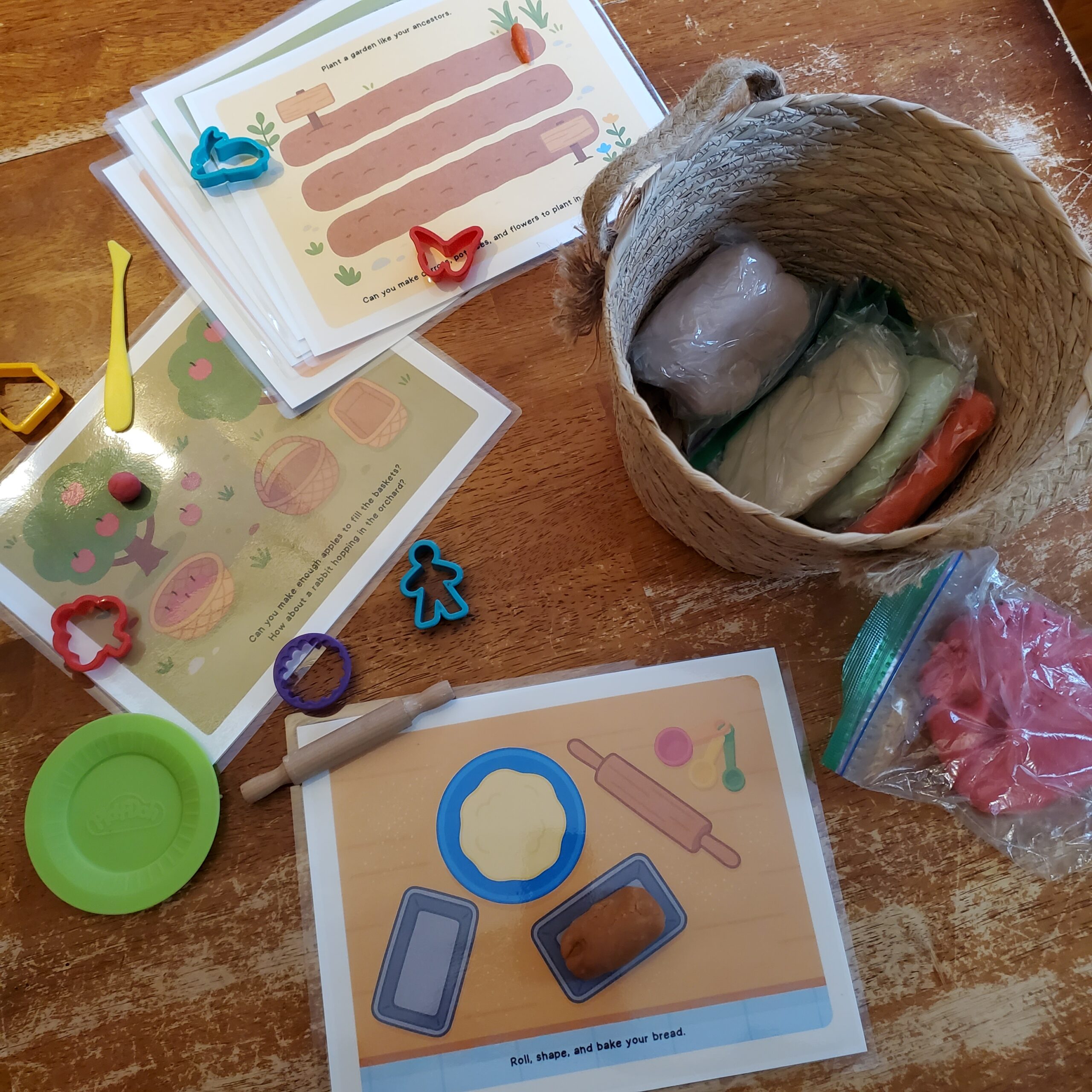 Activity sheets and basket filled with various objects.